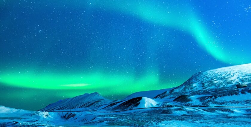 Spectacular Aurora Borealis over a frozen landscape